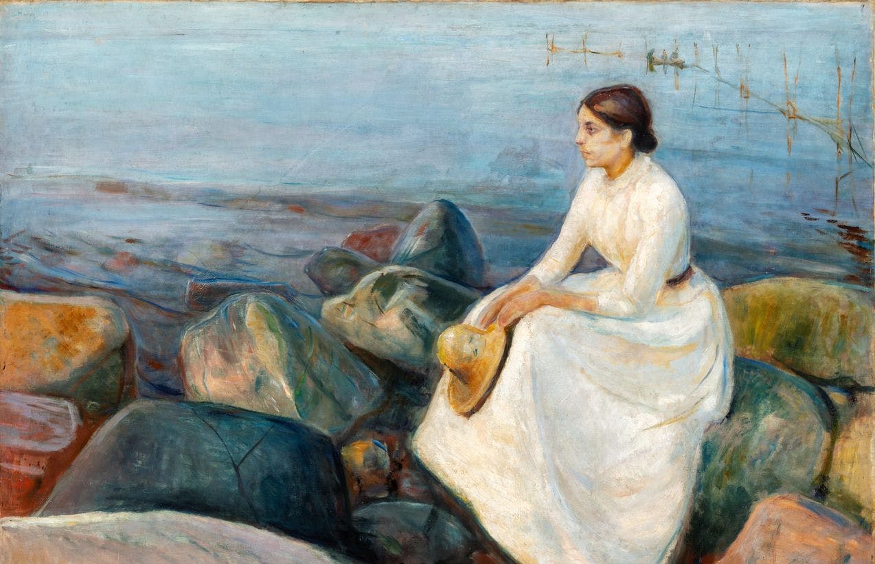 A painting by Edvard Munch depicting his sister Inger, sitting on the shore on a Norwegian light summer eve. She wears a withe long dress and holds a hat in her hands, sitting on some large rocks, looking towards the horizon.
