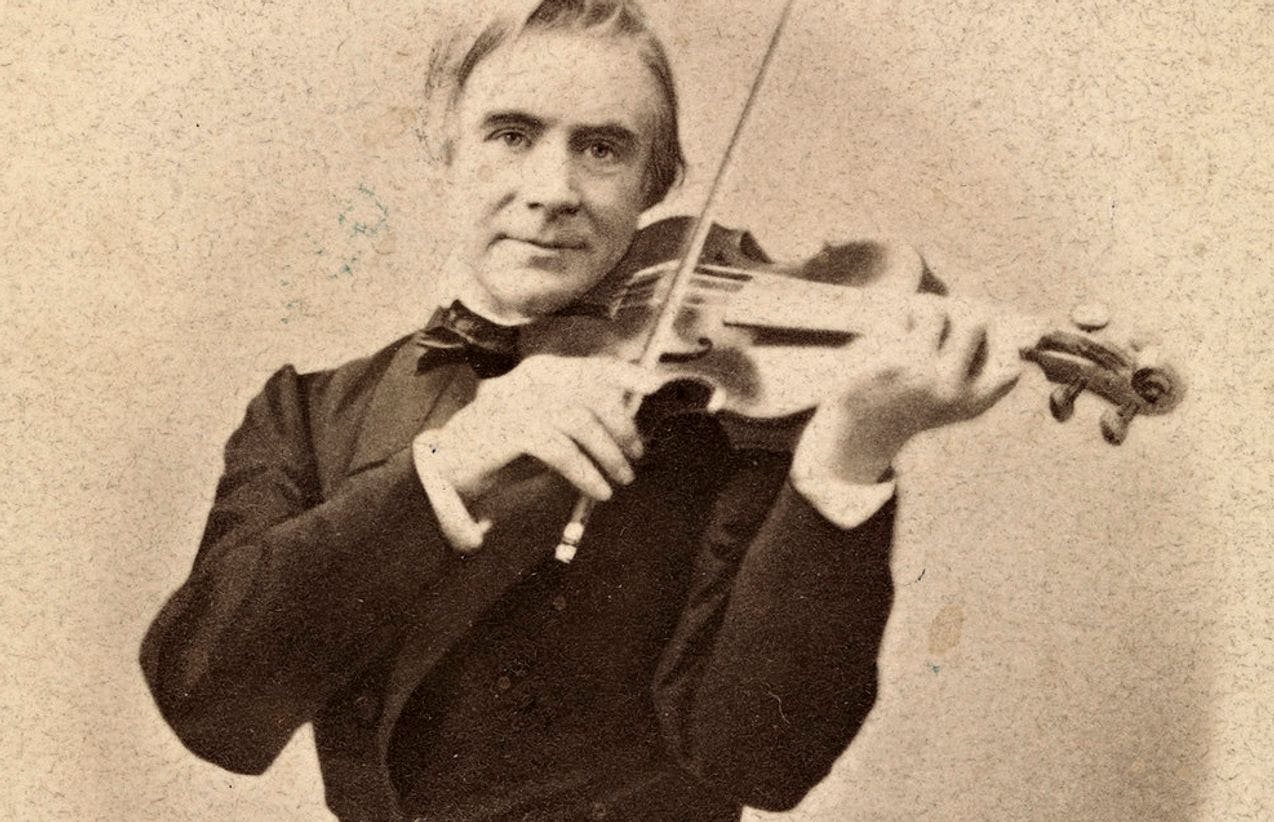 Photo of Ole Bull playing the violin.